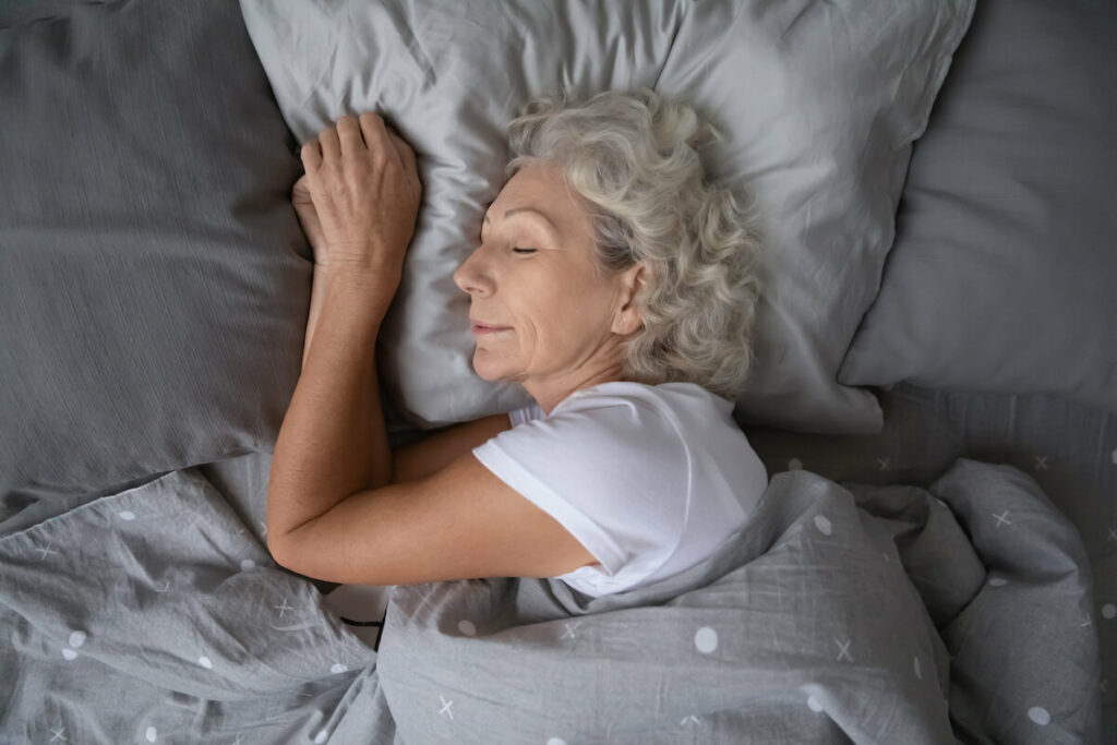 Jasmine Estates of Edmond | Senior woman sleeping peacefully